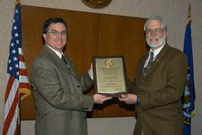 Dr. Byron Bair receiving the award from Dr. Ronald Gebhart